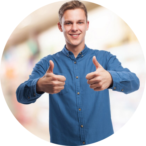 A man smiling and giving a thumbs up in front of a store, conveying positivity and approval.